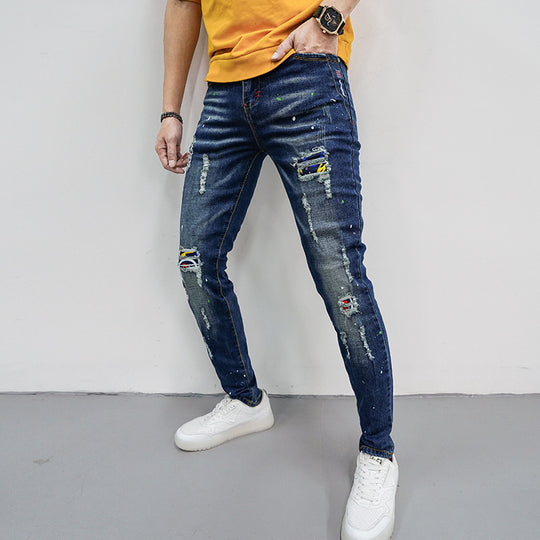 Herren Skinny Fit Jeans mit kreativen Farbklecksen und Rissdesign EB