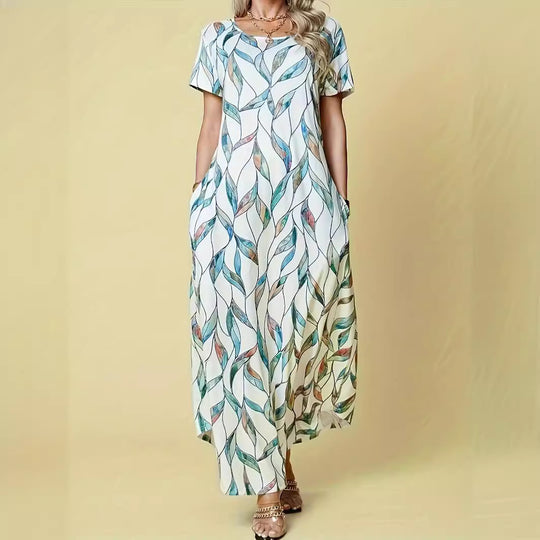Damen Maxikleid mit lebhaftem Blattmuster und praktischen Taschen EB