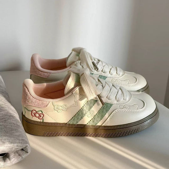 Damen Sneaker mit floralen Applikationen und elastischen Schnürsenkeln EB