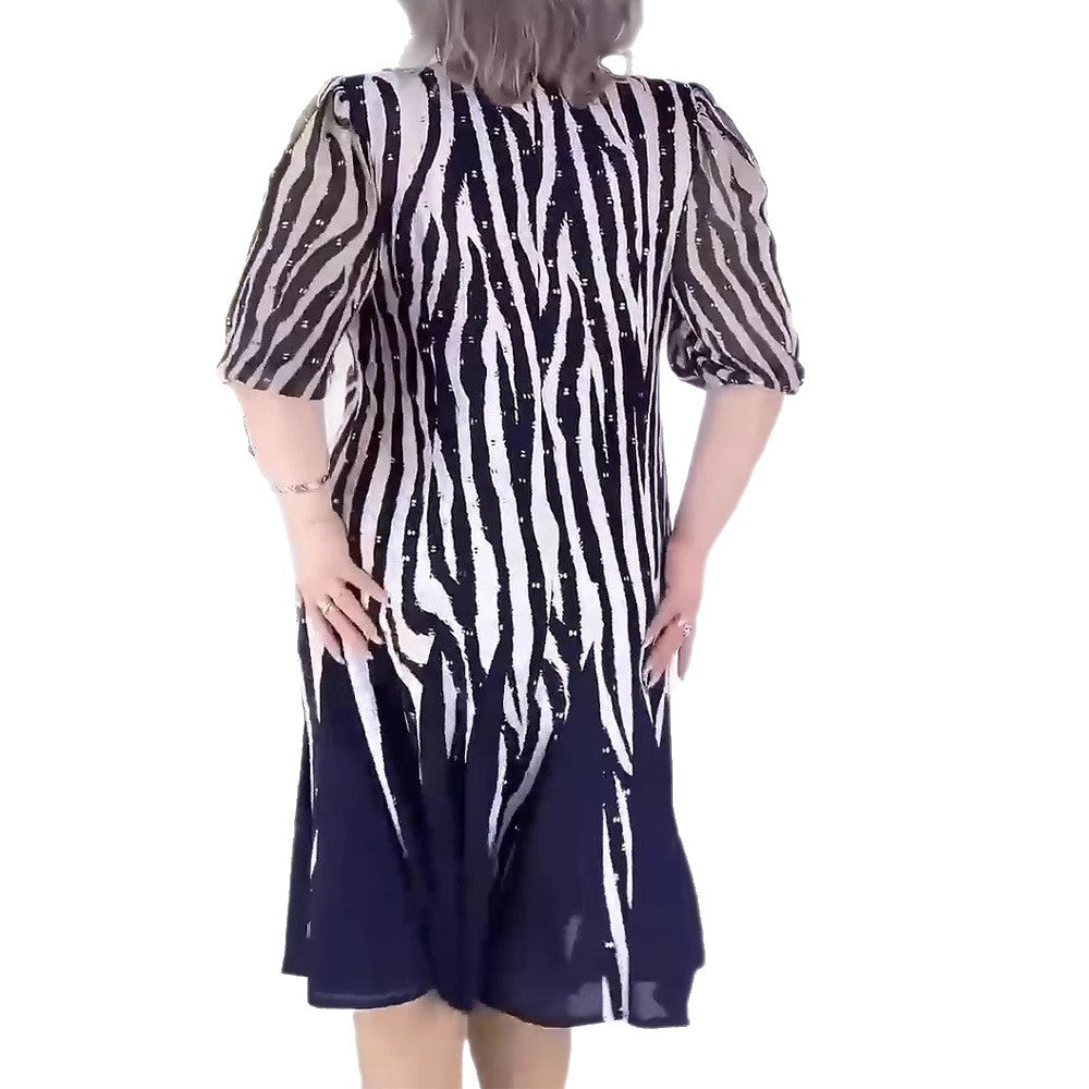 Damen Midikleid mit voluminösen Puffärmeln und dynamischem Streifenmuster Heidi-Mode