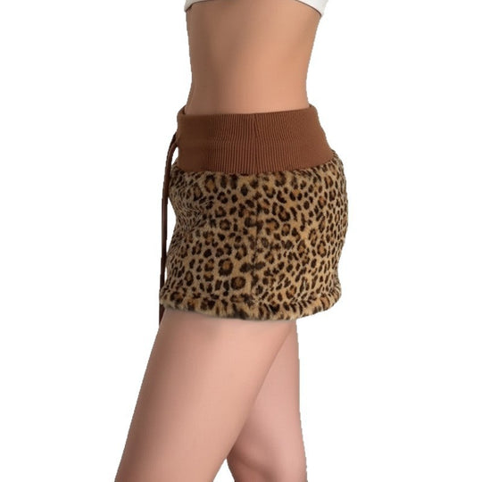 Damen eleganter Minirock aus fellartigem Material mit Modellknopf und Taillenband EB