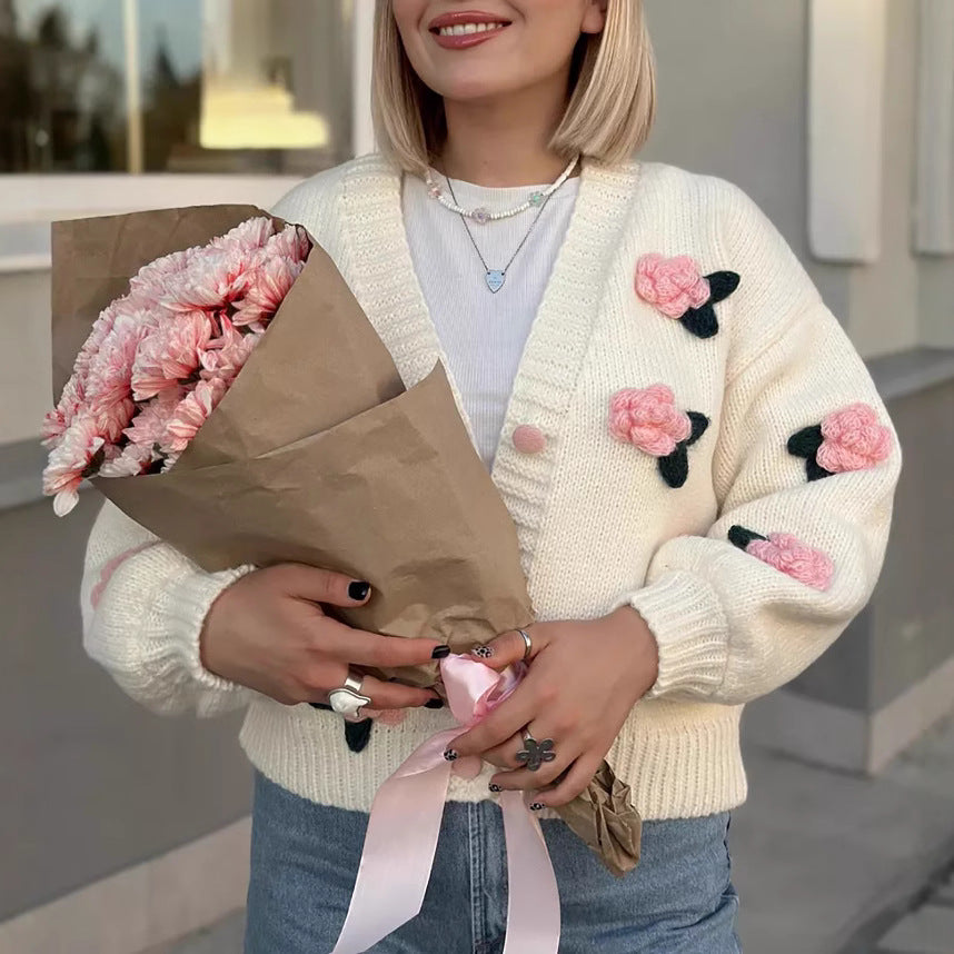 Damen Strickjacke mit floralen Applikationen und voluminösen Ärmeln EB