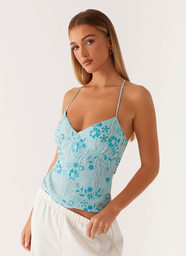 EB | Bestickte Weste Sling
