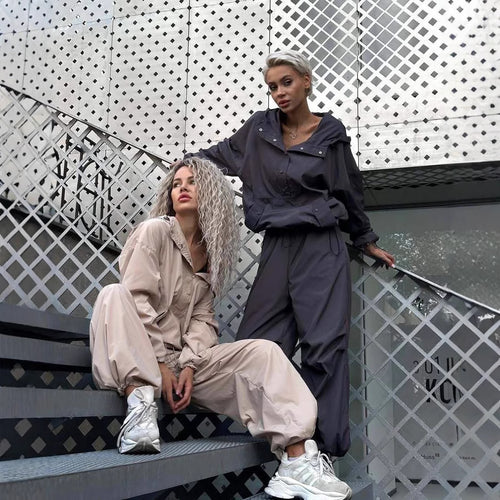 Damen winddichte Technikjacke mit Kapuze und verstellbaren Bündchen EB