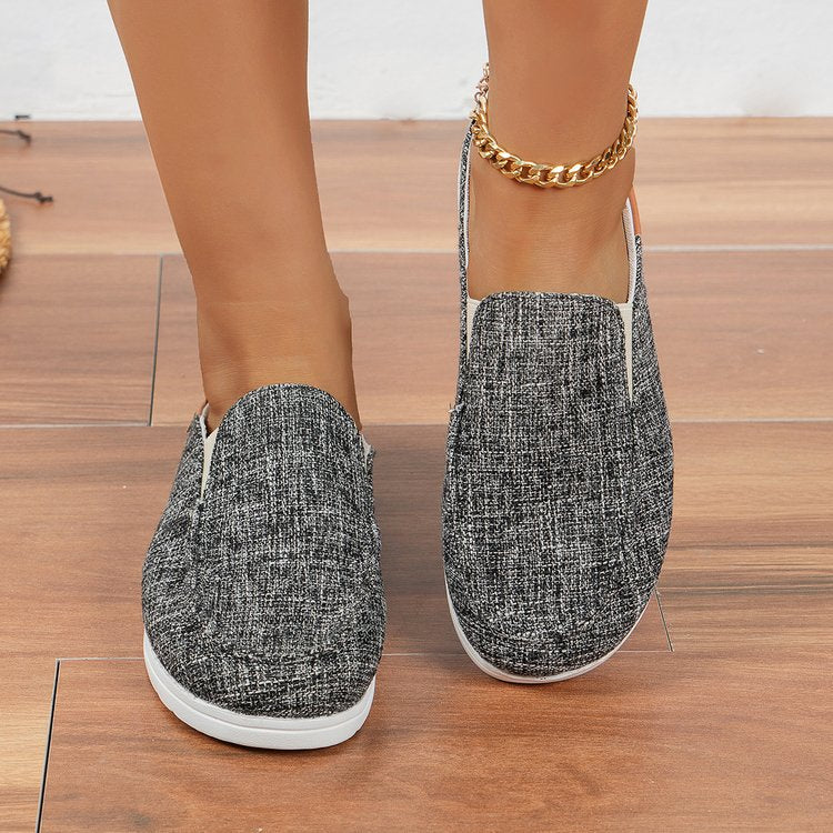 Damen  Slip-On Canvas‑Mules mit Kuhfleckenprint, gepolstertem Komfortfußbett und rutschfester Leichtsohle EB