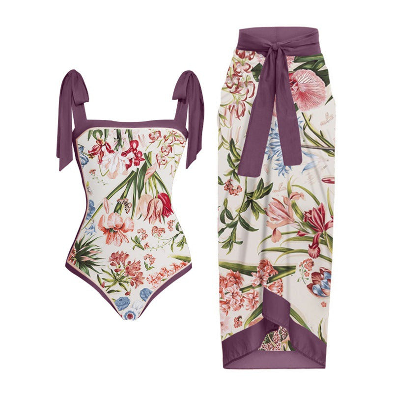 Damen Einteiler Badeanzug mit elegantem Wickelrock und modischen Riemen EB
