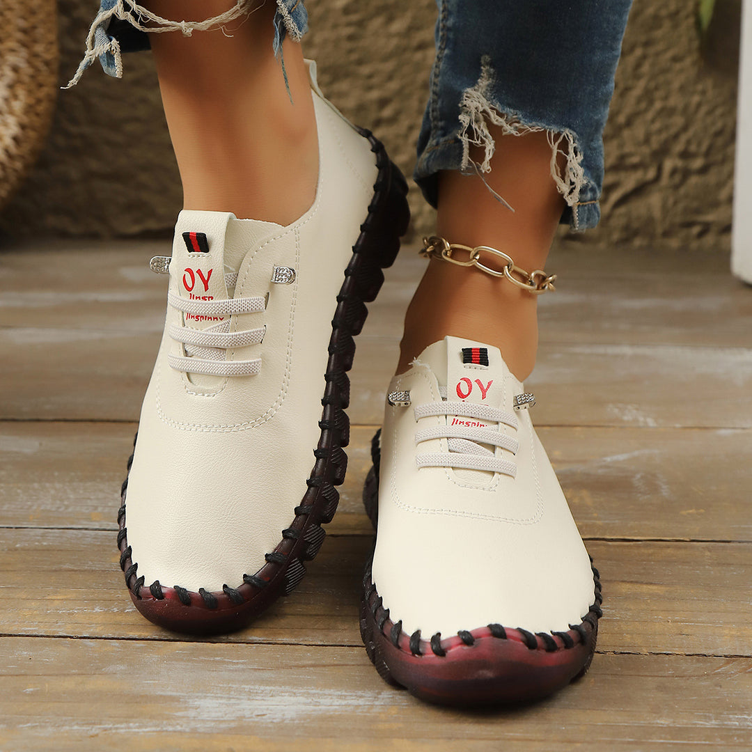 Damen Bequeme Lederoptik-Slipper mit flexibler Profilsohle und Mokassin-Naht EB