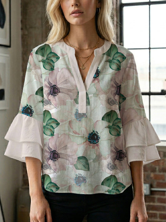 Damen Bluse mit voluminösen Ärmeln und floralem Design EB