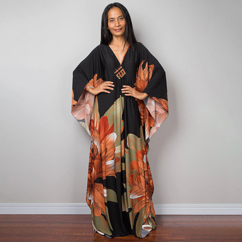 Damen Maxikleid mit kunstvollem Pfauenmuster und seitlichen Schlitzen Heidi Mode
