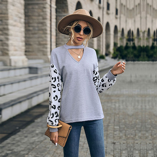 Damen Sweatshirt mit V-Ausschnitt und trendigen Leopardenärmel EB