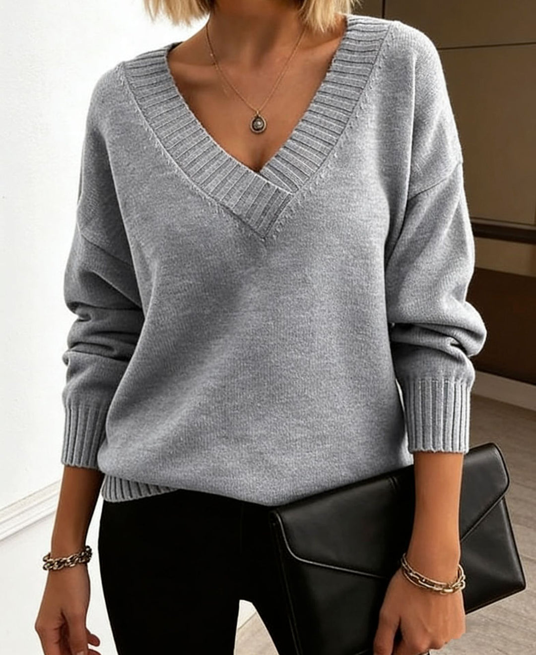Damen Feinstrickpullover mit tiefem V-Ausschnitt und überschnittener Schulter EB