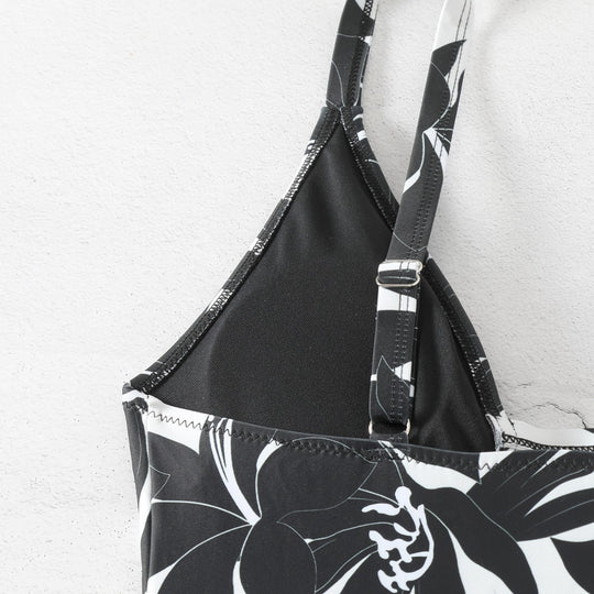 Damen Einteiler Badeanzug mit elegantem floralem Design und modernem V-Ausschnitt EB
