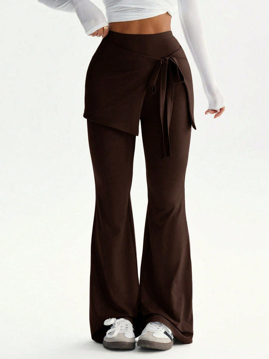 Damen hochtaillierte Schlaghose mit Wickelrock-Overlay und Taillenschleife Eichborn Berlin