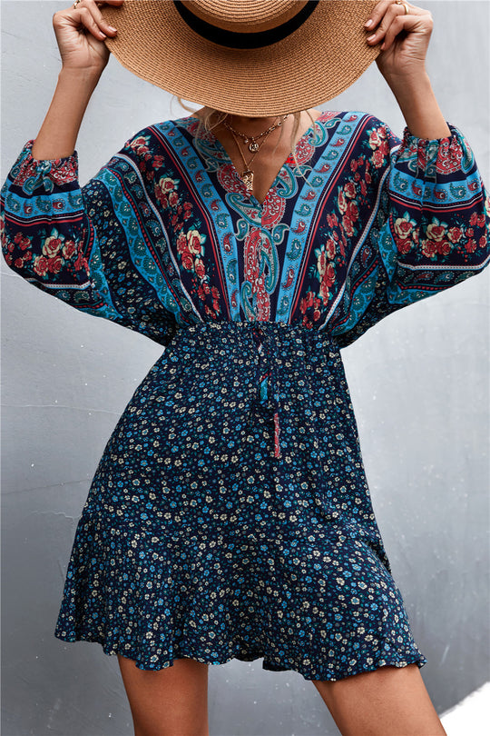 Damen Sommerliches Blusenkleid mit auffälligem floralen Muster und eleganten Puffärmeln EB