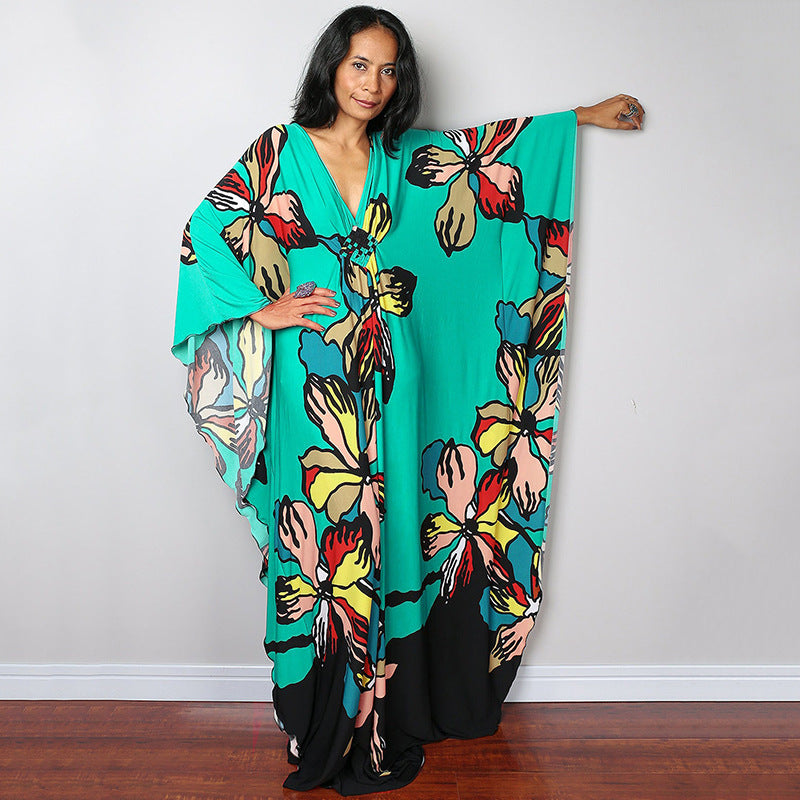 Damen Maxikleid mit kunstvollem Pfauenmuster und seitlichen Schlitzen Heidi Mode