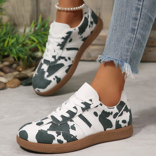 Damen Sportliche Sneakers mit trendigem Kuhdesign EB