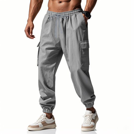 Herren nan konisch zulaufende Jogger im utilitarischen Stil mit elastischem Bund, Kordelzug und Klappentaschen EB