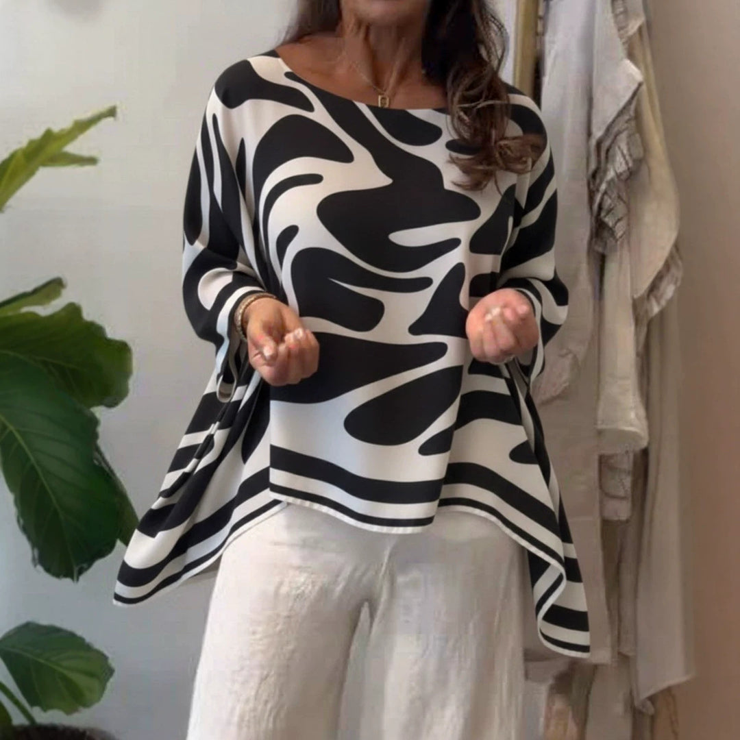Damen Oversize Sommerbluse mit abstraktem Print, Fledermausärmeln und asymmetrischem Saum EB