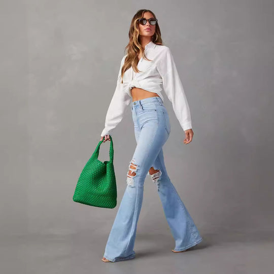 Damen Flared Jeans mit ausgefranstem Saum und verwaschenem Effekt EB