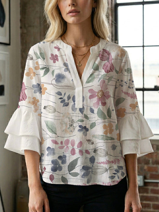Damen Bluse mit voluminösen Ärmeln und floralem Design EB