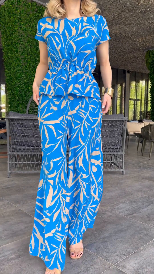 Damen Flowing Jumpsuit mit floralem Design und elastischer Taillierung EB