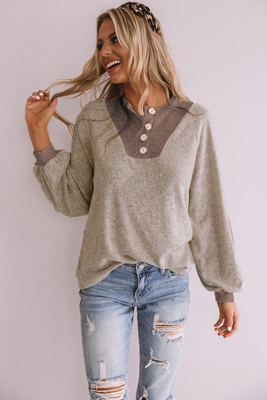Damen Lässiger Sweatshirt mit Knopfleiste und voluminösen Ärmeln EB