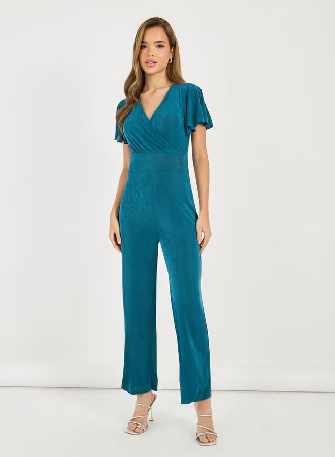 Damen eleganter Jumpsuit mit fließendem Schnitt und detailreichen Puffärmeln EB
