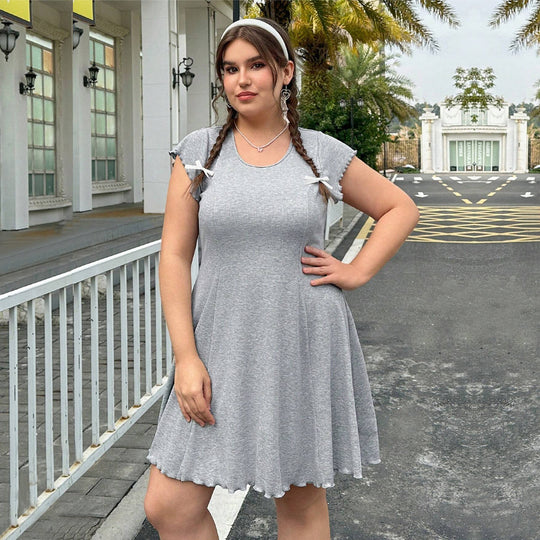 Damen lässiges Jersey-Kleid mit verspielt geschwungenem Saum und dekorativen Bändern EB