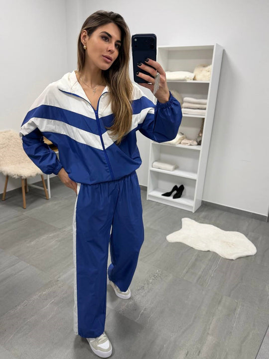 Damen retro Nylon-Trainingsanzug mit Kapuzen-Zipjacke und weiter hochgeschnittener Hose Eichborn Berlin