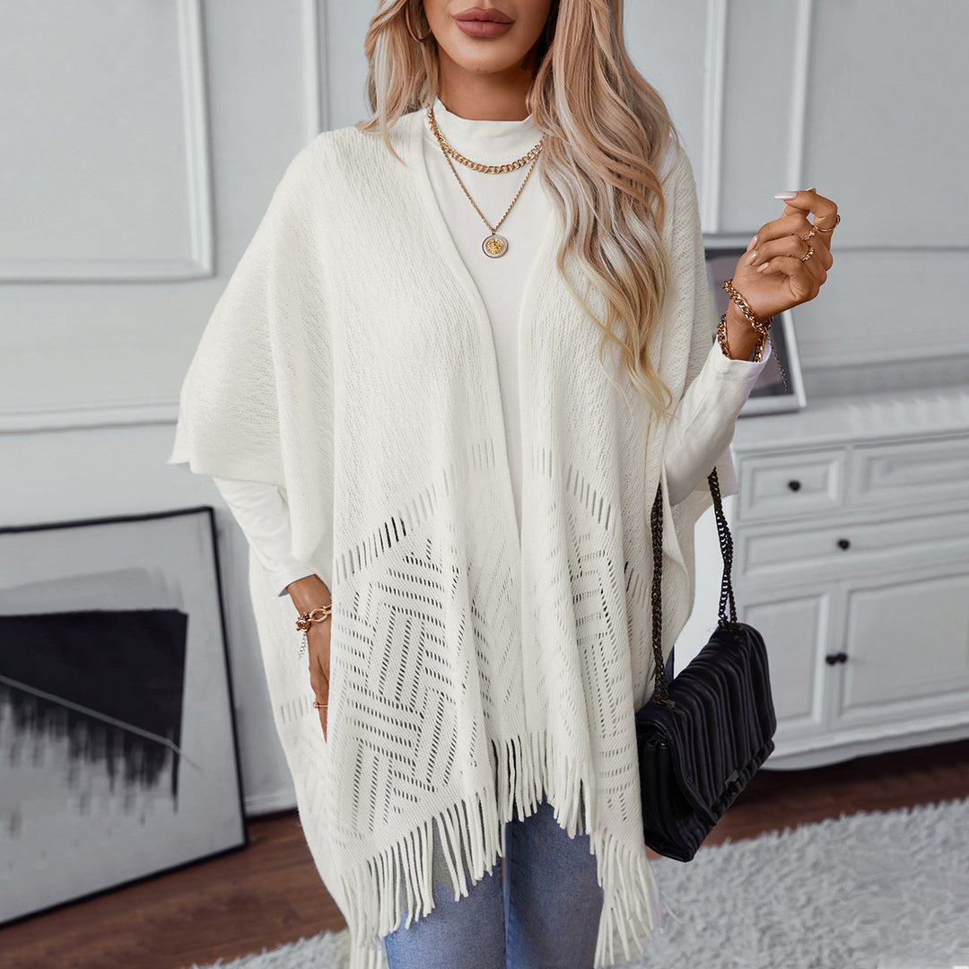 Damen eleganter Strickponcho mit fransigen Details und markantem Muster EB