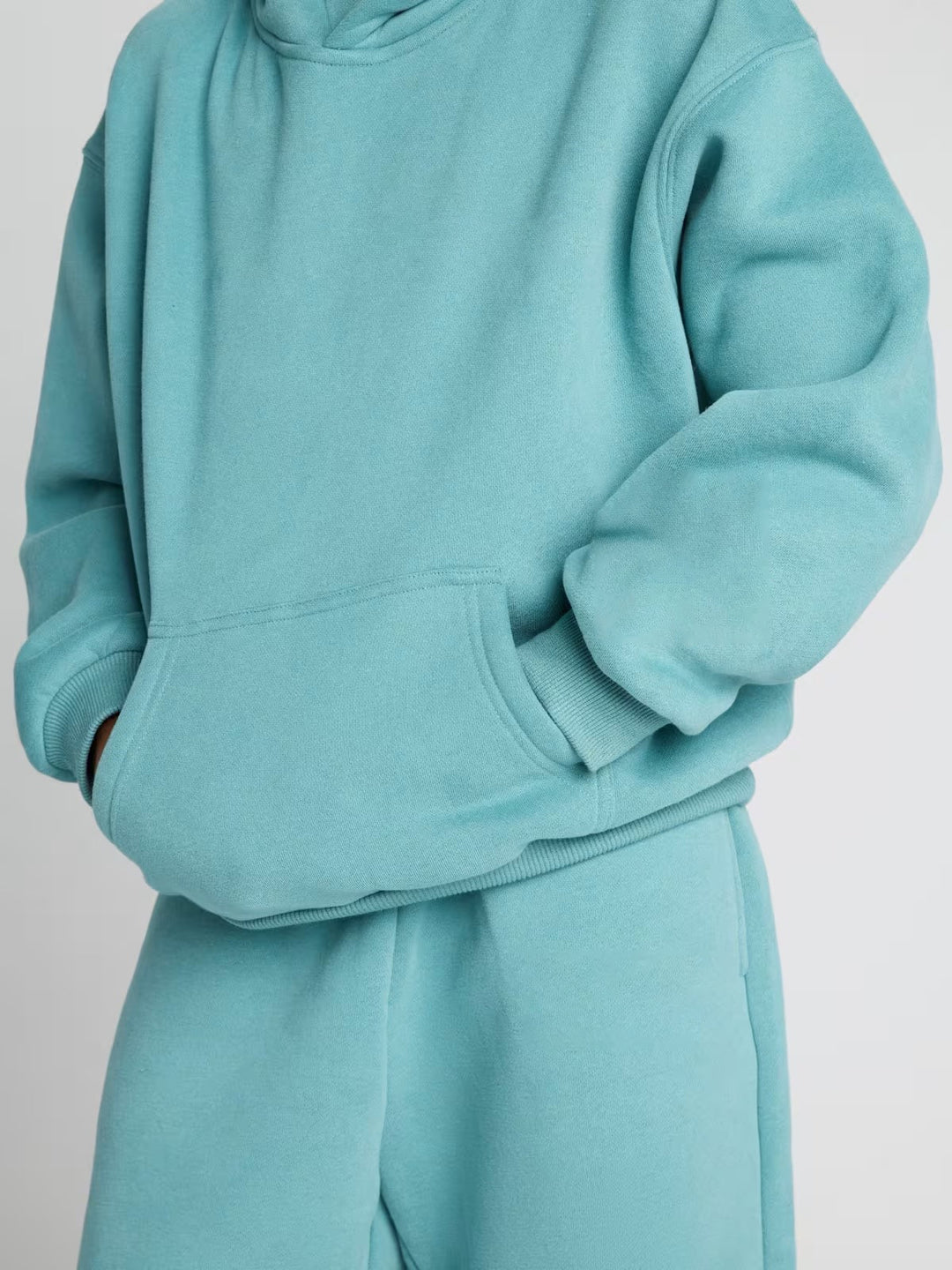 Damen lässiger Fleece-Jumpsuit mit geräumiger Kapuze und praktischen Taschen EB