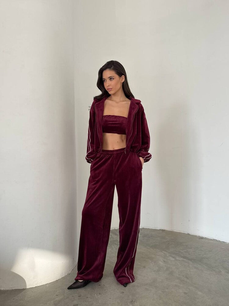 Damen dreiteiliges Samt-Lounge-Set mit Bandeau-Top, Kapuzen-Zipjacke und weiter High-Waist Palazzo-Hose Eichborn Berlin