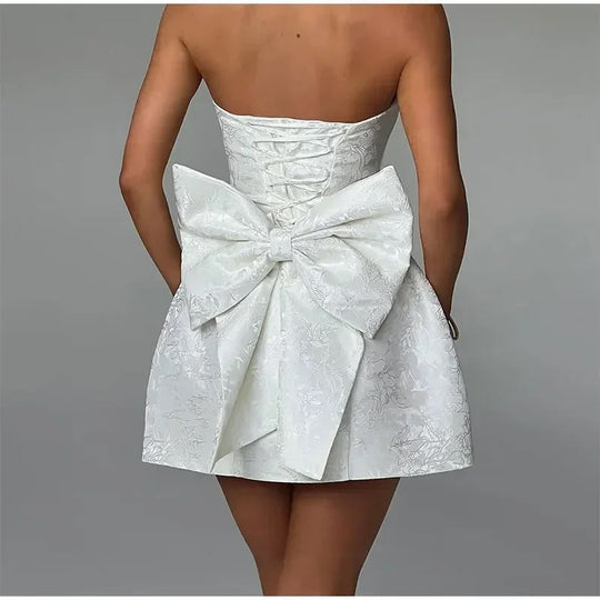 Damen kurzes Kleid mit strukturiertem Oberteil und verspieltem Schleifendetail EB