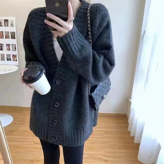 Damen Grobstrickjacke mit voluminösen Ärmeln und knöpfbarem Ausschnitt EB