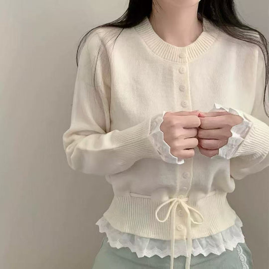Damen kuscheliger Strickjacke mit fransigen Details und Bändchen EB