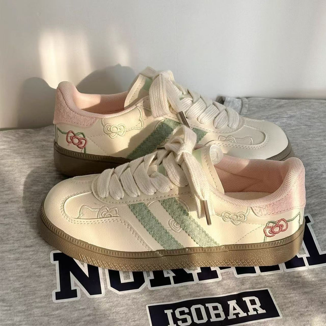 Damen Sneaker mit floralen Applikationen und elastischen Schnürsenkeln EB