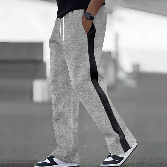 Herren Weite Trackhose mit Kontrastseiten, Tunnelzug und geripptem Bund EB