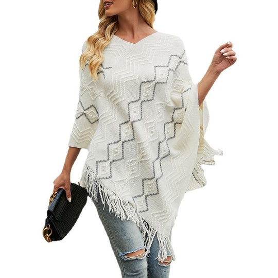 Damen eleganter Poncho mit auffälligem Strukturmuster und dekorativen Fransen EB