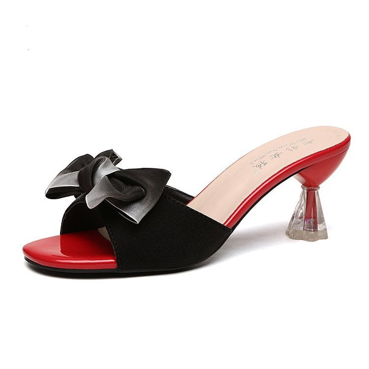 Damen nan elegante Mule mit dekorativer Schleifenapplikation, skulpturellem Transparentabsatz und lackiertem Komfortfußbett EB