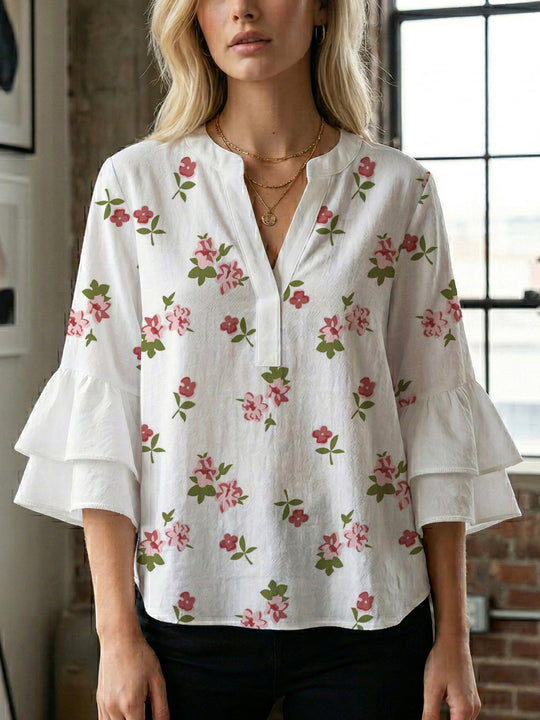 Damen Bluse mit voluminösen Rüschenärmeln und modernem Motiv EB