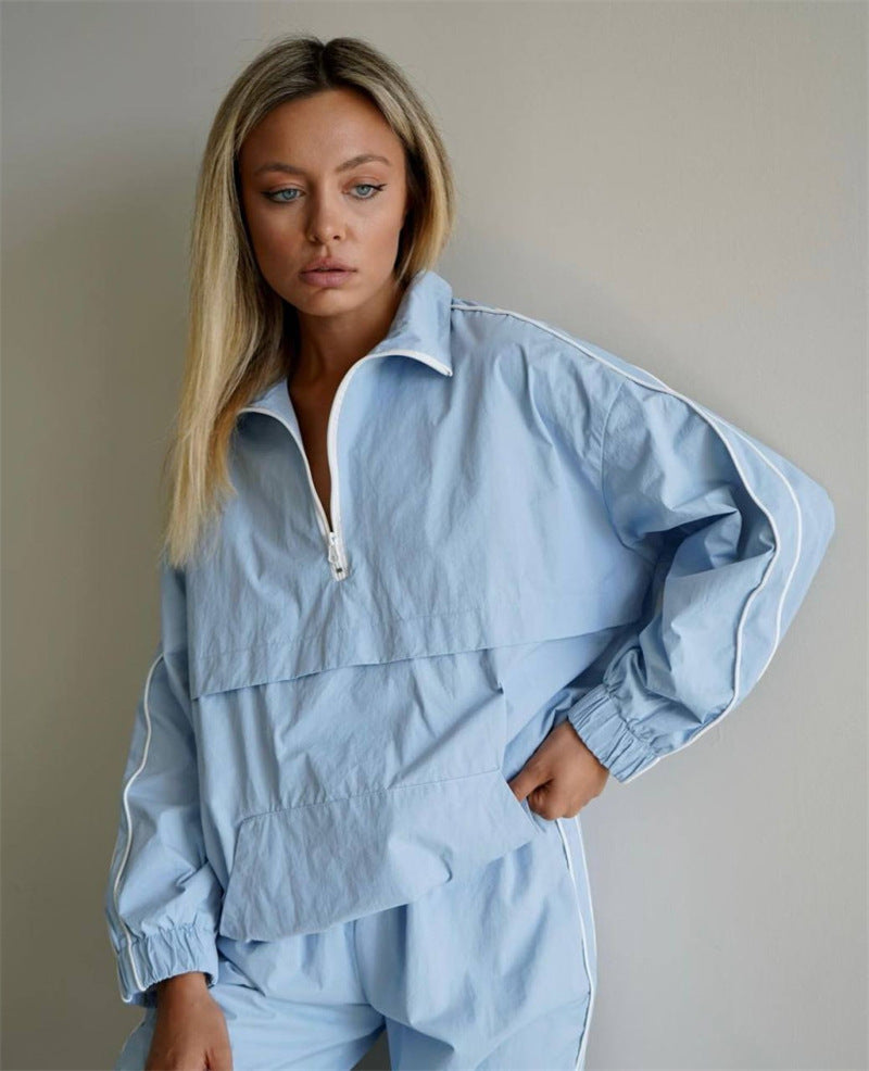Damen leichtes Half-Zip Windbreaker-Oberteil mit Kängurutasche, elastischen Bündchen und seitlicher Paspel Eichborn Berlin