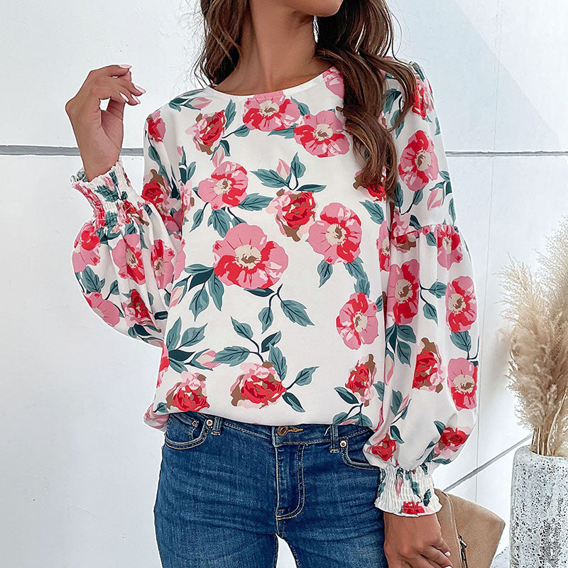 Damen Bluse mit floralem Design und voluminösen Ärmeln EB