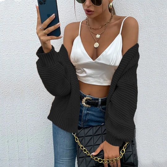 Damen Strickjacke mit voluminösen Ärmel und stylischem Rippenmuster EB