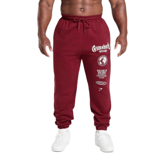 Herren nan konisch geschnittene Baumwollfleece-Sweathose mit elastischem Kordelbund gerippten Beinabschlüssen und großflächigem Logodruck EB