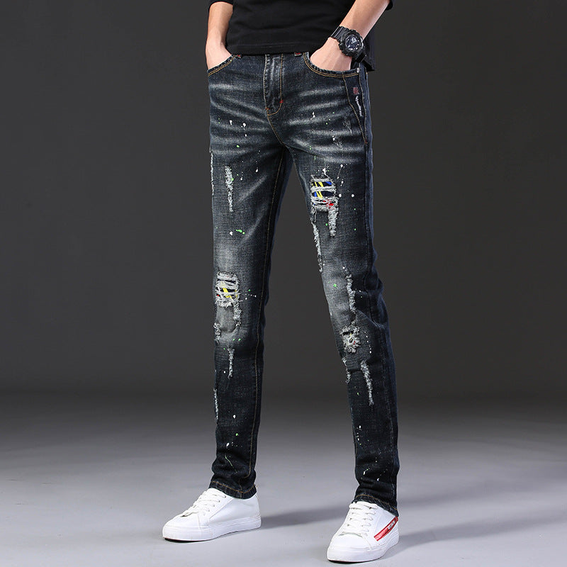 Herren Slim Fit Jeans mit kreativen Rissdesign und Farbklecksen EB