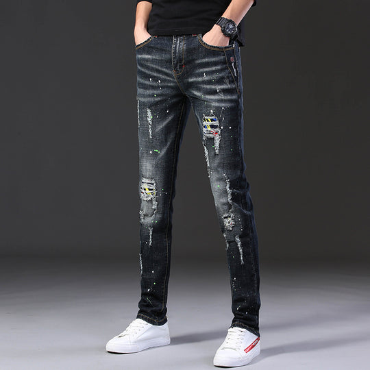 Herren Slim Fit Jeans mit kreativen Rissdesign und Farbklecksen EB