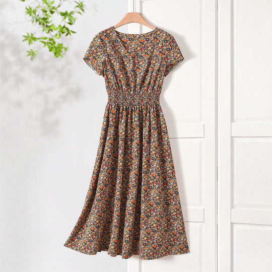 Damen Sommerliches Midikleid mit elastischem Bund und floralen Mustern EB