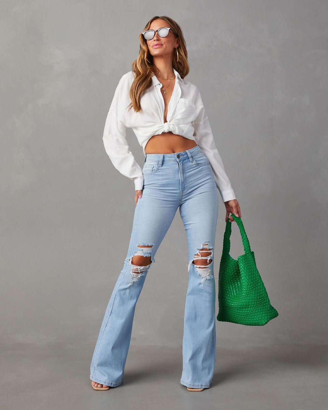 Damen Flared Jeans mit ausgefranstem Saum und verwaschenem Effekt EB