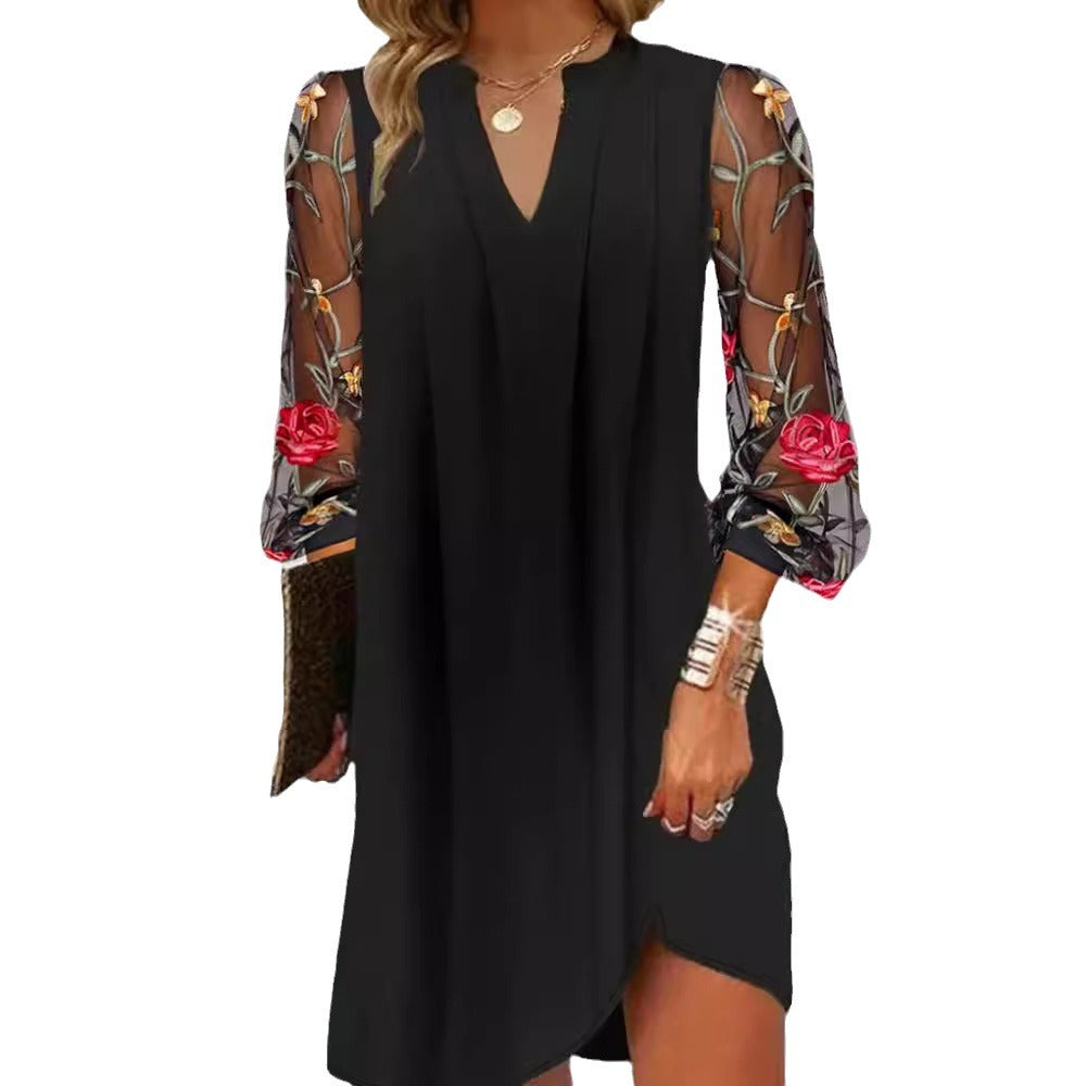 Damen Kleid mit transparenten Spitzenärmeln und floralem Design Heidi-Mode
