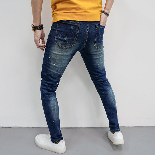 Herren Skinny Fit Jeans mit kreativen Farbklecksen und Rissdesign EB